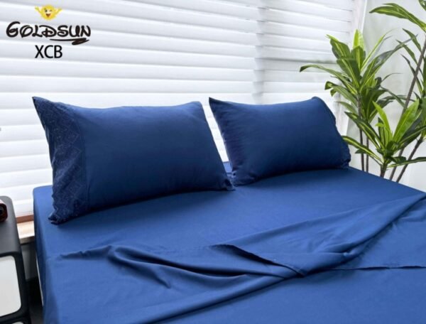 SET DE SÁBANAS 4 PCS COLOR ENTERO CON BORDADO INGLÉS (CAJAX48UND)